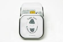 The Tappy Feet Tap Step Card Deck (Beginning) in it's tin with the top open, showing the card on top of the deck, which is the Key Card, a card to help you understand how to read the  cards in the box